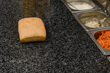The process of making a panini in a fast food restaurant, a panini bun close-up.