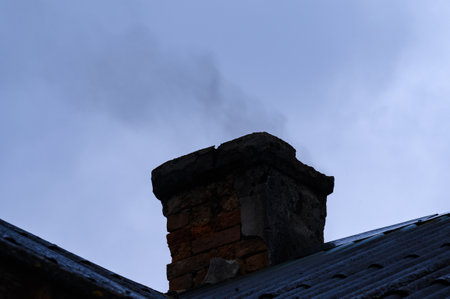 The emergency old chimney smokes and operates in violation of fire safety
