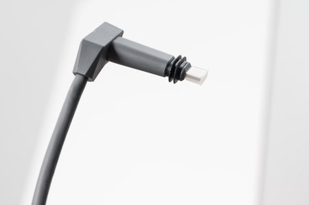 Ivano-Frankivsk, Ukraine December 2, 2023: adapter cable for Starlink satellite antenna on a white...