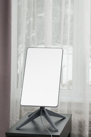 Ivano-Frankivsk, Ukraine, December 2, 2023: Starlink satellite dish in the middle of the house near the window, wireless internet.のeditorial素材