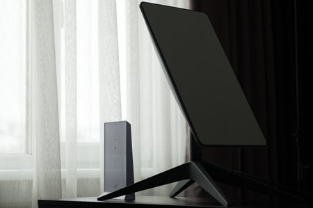 Ivano-Frankivsk, Ukraine, December 2, 2023: Starlink satellite dish in the middle of the house near the window, wireless internet.のeditorial素材