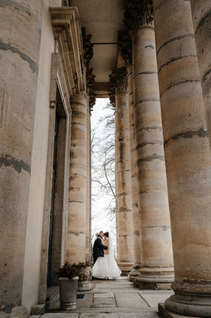 Lviv, Ukraine March 4, 2023: The bride and groom near the chapel of Pidhoretskyi Castle.のeditorial素材