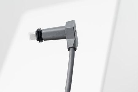 Ivano-Frankivsk, Ukraine December 2, 2023: adapter cable for Starlink satellite antenna on a white background.のeditorial素材