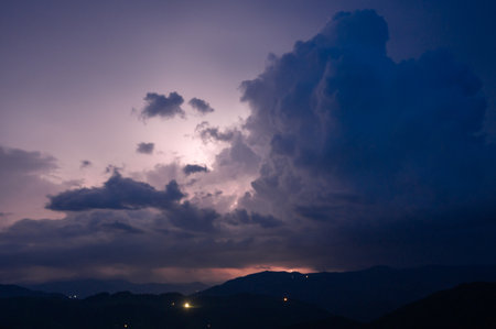 An evening thunderstorm with lightning in the Carpathian mountains, the village of Dzembronya....