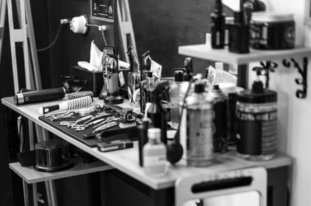 Barbers tools for mens haircuts laid out on a table close upの写真素材