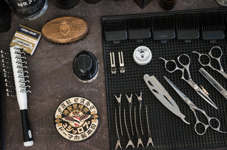 Ivano-Frankivsk, Ukraine February 23, 2024: view of a table with working equipment in a barbershop.のeditorial素材