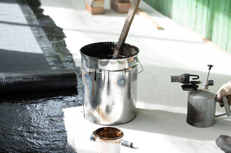 A large bucket of resin for waterproofing the floor in the house, repair work in the house.