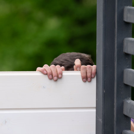 Installing and aligning boards in grooves when installing a wall in a gazebo, construction work and moments during the construction of a gazebo.の写真素材