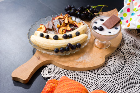 Healthy breakfast or snack with fruit, yogurt and dessert.の写真素材