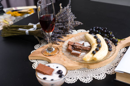 Dessert, fruit, and wine on a tableの写真素材