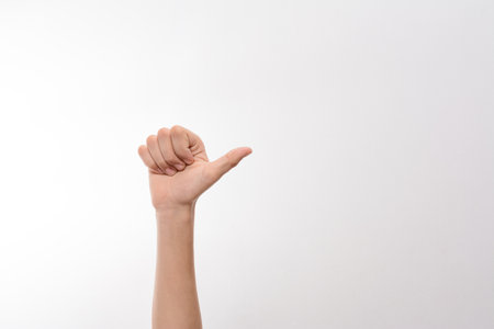A close-up shot of a hand making a gesture, possibly indicating direction, or representing something...