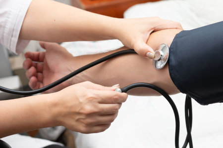 This image depicts a healthcare setting where a provider is skillfully using a stethoscope and cuff...