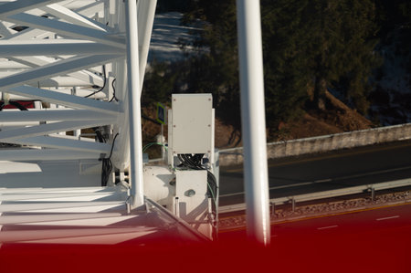 High above the ground, an intricate installation reveals a blend of modern technology and nature, as...