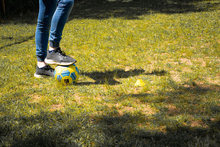 Person's feet on soccer ball, outdoor practice.の写真素材