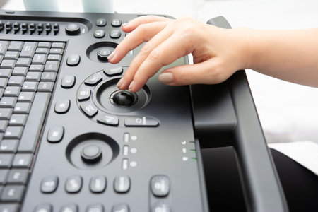 A person is using a modern medical device with an ergonomic design. The image focuses on the...