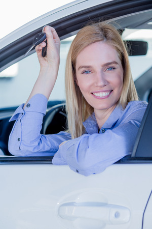 Beautiful young woman in carの写真素材