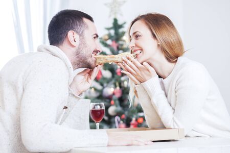 Couple in love at Christmas dinnerの写真素材