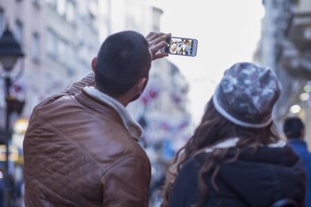 Young couple in love in the city walksの写真素材