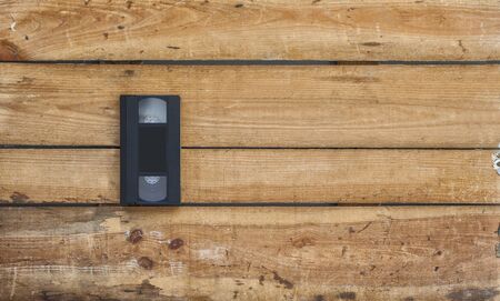 Video cassette close-up on vintage wooden backgroundの写真素材