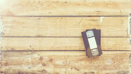 Video cassette close-up on vintage wooden backgroundの写真素材