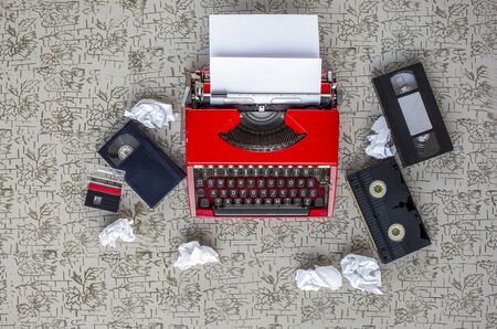 Equipment single journalists. Old typewriter, crumpled paper, video tapes, cassettes and beta dv...