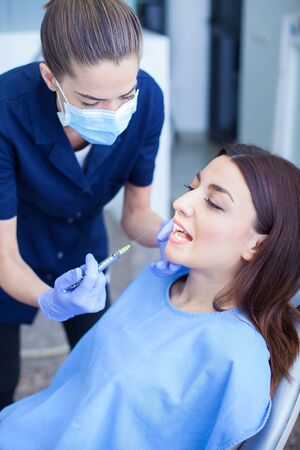 Woman visiting her dentistの写真素材