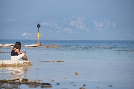 Girl on the lakesideの写真素材