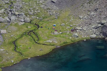 Camping next to an alpine lakeの写真素材