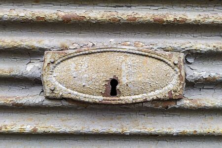 Old scraped door lock of a shutterの写真素材