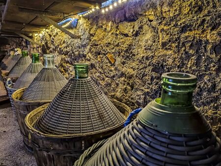 Demijohn in a wine cellar in the Italian countrysideの写真素材