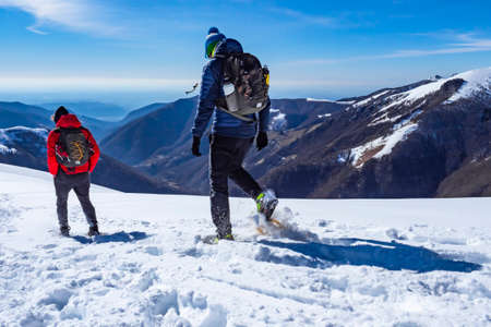 Close-up of snowshoeing activity in the italian alpsの写真素材