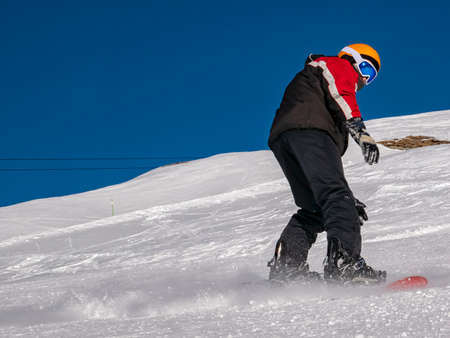 Snowboarder on a ski slopeの写真素材