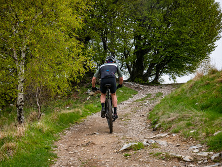 Cycling on a mountain trailの写真素材