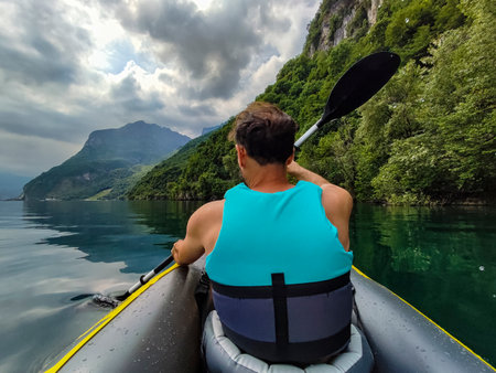 Paddle on Lake Como in a cloudy dayの写真素材