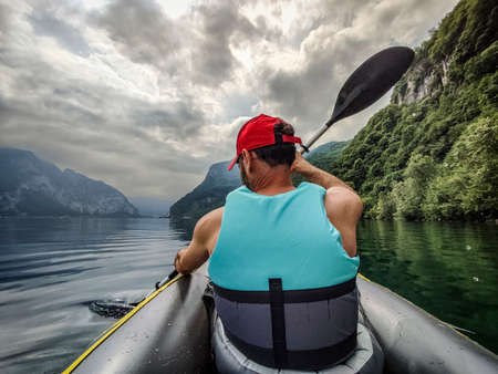 Paddle on Lake Como in a cloudy dayの写真素材