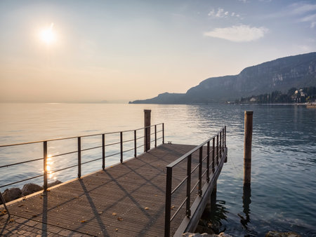Pier on Lake Garda at sunsetの写真素材