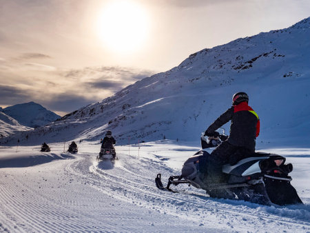 Snowmobile on a trail in the Italian alpsの写真素材