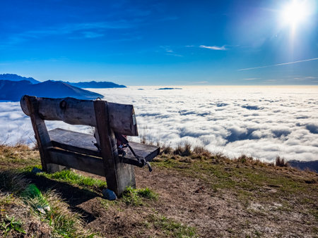 Bench over the clouds in the alpsの写真素材