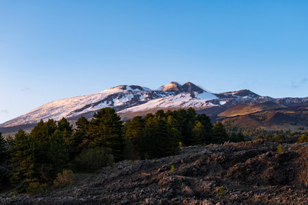Cold lava flow on mount Etna volcano at sunsetの写真素材