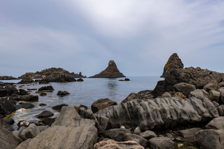 Cliffs on the sicilian coast in Aci Trezzaの写真素材