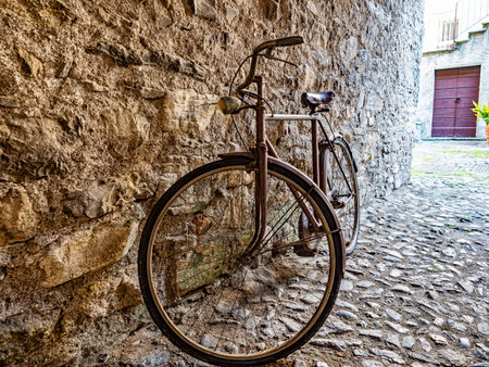 Old Bicycle in an alley of an Italian villageの写真素材