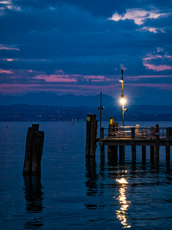 Ferry dock on Lake Garda at sundownの写真素材