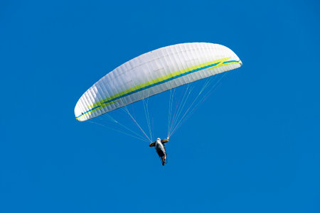 Paraglider flying in the skyの写真素材