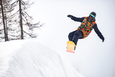 Snowboarder on a slope in the alpsの写真素材
