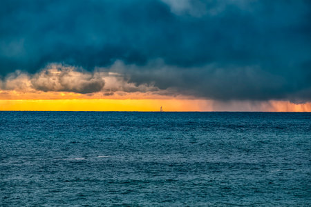 Storm on the Ligurian sea at sunsetの写真素材