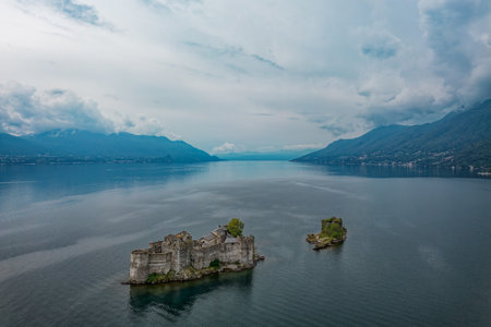 The Cannero castle island on Lake Maggiore edited without the construction craneの写真素材
