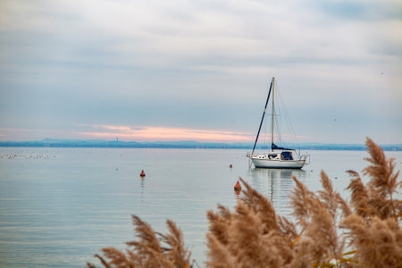 Sailboat moored on Lake Gardaの写真素材