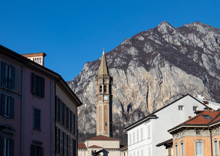 View of the bell tower of Lecco from an alley of the townの写真素材