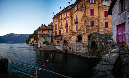 View of the stone bridge of Nesso village on Lake Comoの写真素材