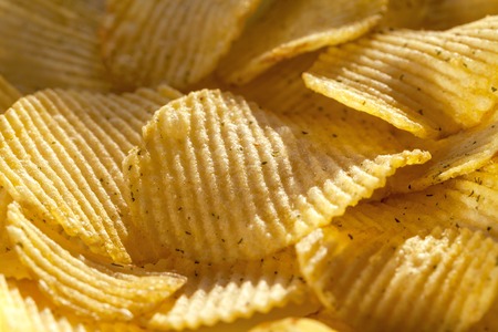 Background of delicious potato chips with spices. Closeupの写真素材